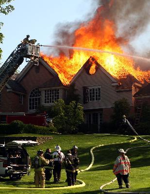 IC operating in front of fire building. Chappaqua Fire (5/30/08)